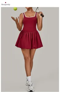 Close-up of wine red sports dress with white piping trim and flared tennis skirt