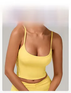 Detail of ginger yellow sports bra with U-neck and thin straps on professional model