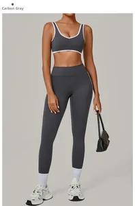 Detail view of charcoal gray yoga set with contrasting white trim and high-stretch fabric