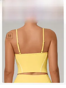 Detail of yellow yoga sports bra back with adjustable straps and slim fit design