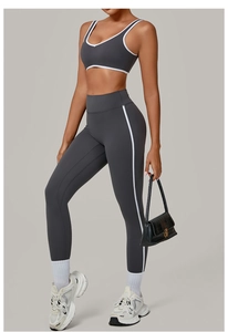 Detail of contrast binding on dark grey yoga set with high waist leggings and sports bra