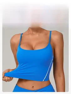 Detail of blue yoga vest featuring contrast slim straps and white side stripe accents