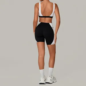 Back view of women's backless yoga set featuring two-tone sports bra and high-stretch shorts