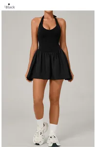 Close-up of black backless tennis dress with pleated skirt and athletic fit detail