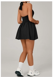Detail of the backless tie-up neck design on the black tennis dress for outdoor sports