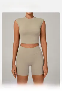 Macro shot of breathable beige yoga top fabric and high-waisted fitness shorts
