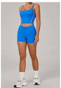 Detail view of electric blue high-waist sports shorts and fitted crop top set