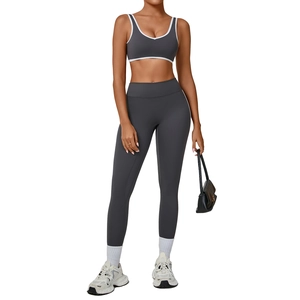 Gray contrast piping yoga set with high-waist leggings and cross-back sports bra