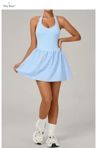 Detail view of the pleated sky blue tennis dress with open back and lace-up neck design