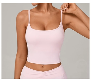 Detail of light pink yoga camisole with thin double straps and built-in chest pads