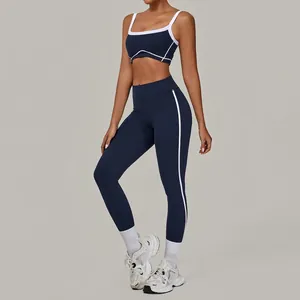 Zweiteiliges dunkelblaues Yoga-Set mit weißen Kontrastpaspeln und High-Waist-Leggings