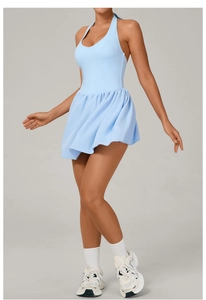 Detail of light blue tennis dress with halter neck and pleated skirt for sports