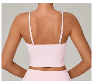Detail of adjustable dual straps and back design on the light pink sports yoga vest