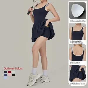 Women's backless tennis golf dress with contrast straps and built-in shorts pockets