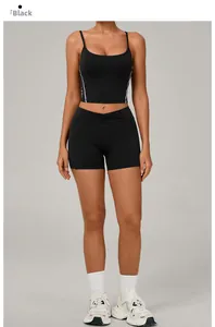 Close-up of black high-stretch yoga set with cross-back tank top and high-waist shorts