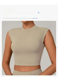 Close-up showing the round neckline and snug fit of the khaki yoga crop top