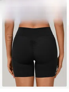 Close-up of black high-waisted yoga shorts with scrunch butt detail for lifting