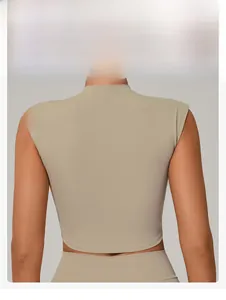 Slim fit beige quick-dry yoga top showing ergonomic back cut and waist shaping detail