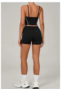 Back view of black yoga set with strappy sports bra and high waisted shorts