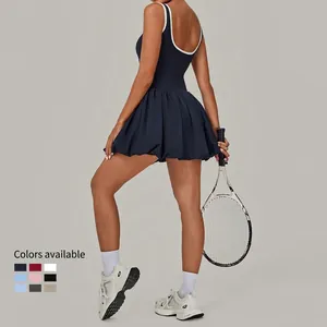 Women's backless navy blue tennis dress with contrast trim and pleated skirt hem