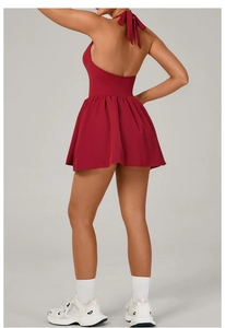 Deep red lace-up backless tennis dress with halter neck and pleated skirt detail