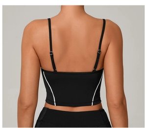 Detail view of the black sports vest back with white trim and adjustable straps