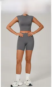 Detail of dark grey seamless yoga set showing high waist shorts and cropped short sleeve top