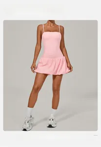 Detail of light pink sleeveless yoga dress with thin straps and bubble skirt silhouette