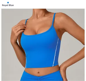 Detail view of royal blue sports bra with white stitching and high-elastic fabric