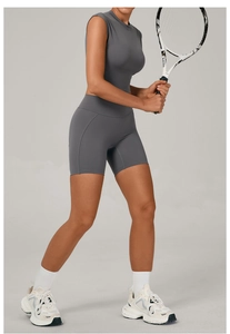 Close-up of seamless dark grey yoga set with breathable fabric texture and stitching