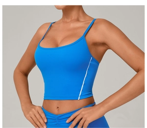 Close-up of blue yoga sports tank top featuring thin straps and white side stripe detail