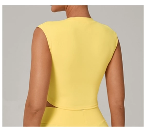 Close-up of bright yellow slim fit quick-dry yoga top back detail with seamless design