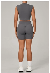 Detail view of dark grey yoga set with high waist scrunch leggings and seamless racerback top