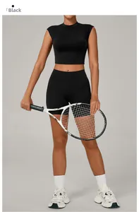 Detail of black seamless yoga set with stand-up collar top and high waist sports shorts