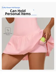 Pink tennis dress with pleated bubble hem featuring a side pocket for tennis ball storage