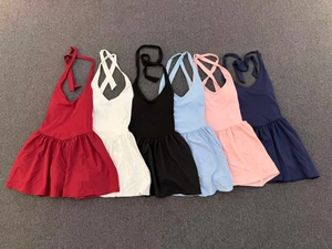 Detailed flat lay of women tennis dresses in six colors featuring pleated skirts and back ties