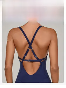 Close-up of adjustable criss-cross back straps with metal buckles on navy yoga bodysuit