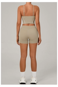 Detail view of khaki yoga set showing back design with sports crop top and high waist shorts