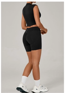 Detail of black seamless yoga set showing scrunch butt leggings and cropped tank top
