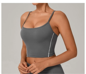 Close-up of charcoal yoga bra featuring thin double straps and white contrast stitching