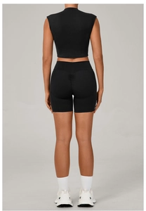 Back view of black high-waisted yoga shorts with scrunch butt detail and seamless crop top