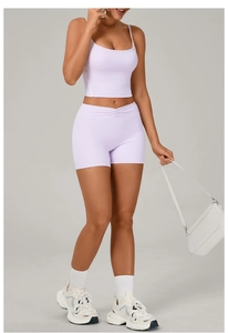 Detail of lavender athletic set showing waist ruching and high-elastic ribbed texture