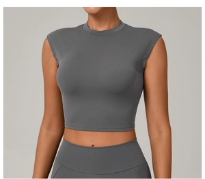 Detail of dark grey slim fit crop top showing high-elasticity quick-dry knit fabric