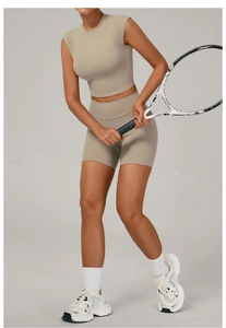 Close-up of khaki high-stretch seamless yoga set including crop top and gym shorts