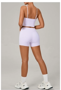 Rear view of a lavender yoga set showing slim fit crop top and high waist sports shorts