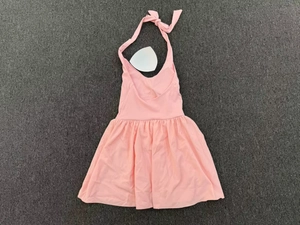 Detailed flat lay of pink halter tennis dress with ruffled hem and removable bra pads
