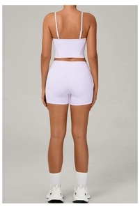 Rear view of lavender purple yoga set showing racerback sports bra and high-waisted shorts