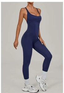 Detail of navy blue yoga jumpsuit showing U-neckline and tummy control stitching