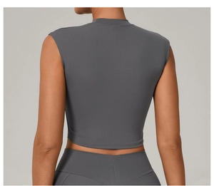 Detail view of charcoal gray slim fit yoga top with a high neckline and high-stretch fabric