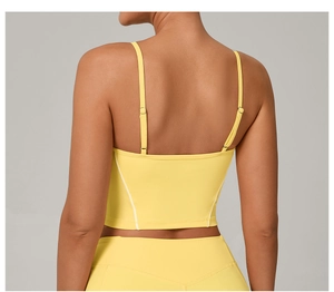 Close-up of adjustable double straps and back design on yellow yoga sports bra